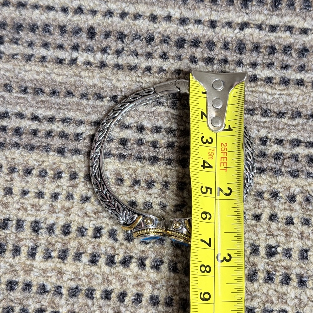 Elegant Silver and Gold Tone Bracelet Blue Accents Dec Birthstone Hinge Bangle - Picture 10 of 10